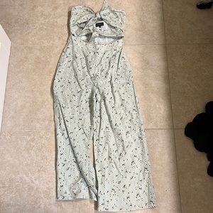 Daisy print jumpsuit with cutout details